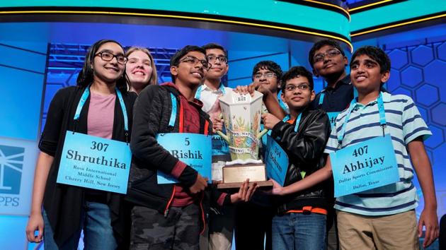 Shruthika Padhy, 13, Erin Howard, 14, Rishik Gandhasri, Christopher Serrao, 13, Saketh Sundar, 13, Sohum Sukhatankar, 13, Rohan Raja, 13, and Abhijay Kodali, 12, celebrate their eight-way tie in the final round of the 92nd annual Scripps National Spelling Bee at National Harbor in Oxon Hill, Maryland. (Joshua Roberts / REUTERS)