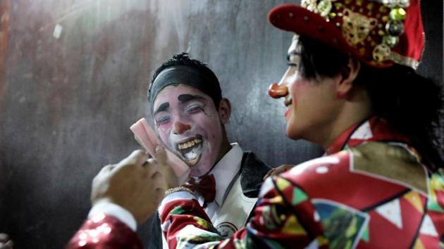 Clowns prepare to take part in a parade during Peru’s Clown Day celebrations in Lima, Peru. (Guadalupe Pardo / REUTERS)