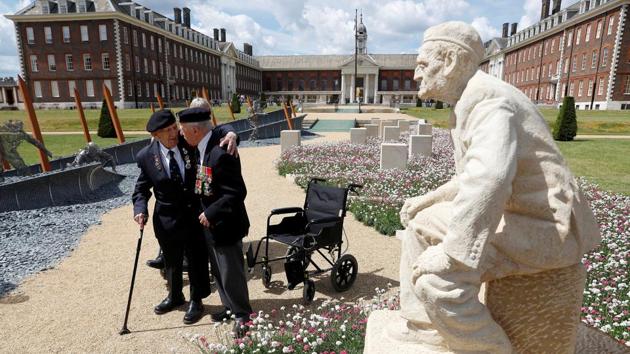 D-Day veterans walk through the ‘D-Day 75 Garden’ on display at the RHS Chelsea Flower Show in London, England. (Peter Nicholls / REUTERS)