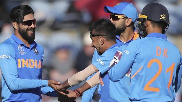 India's Ravindra Jadeja, left, celebrates with teammates the dismissal of Bangladesh's Sabbir Rahman.(AP)
