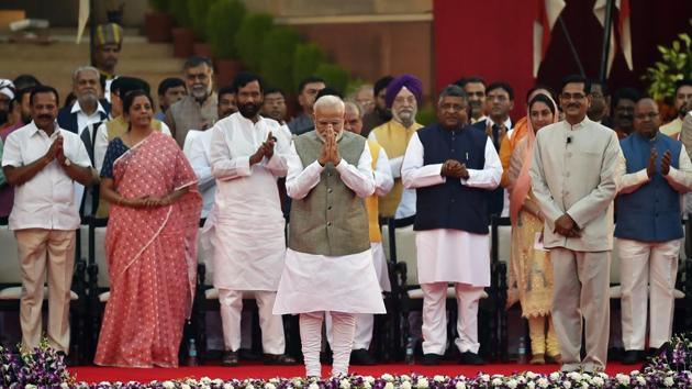 As the sun went behind the dome, the full frame of the council of ministers of the new government came to light. In all, 58 ministers were administered their oaths of office by President Ram Nath Kovind, who gently ticked off one or two for skipping key words and helpfully prompted a few others. (Ajay Aggarwal / HT Photo) As the sun went behind the dome, the full frame of the council of ministers of the new government came to light. In all, 58 ministers were administered their oaths of office by President Ram Nath Kovind, who gently ticked off one or two for skipping key words and helpfully prompted a few others. (Ajay Aggarwal / HT Photo)