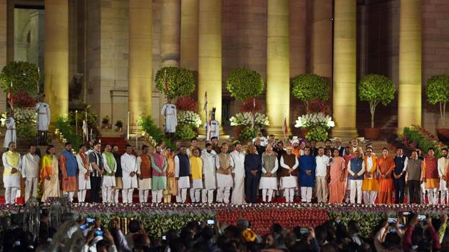 Prime Minister Narendra Modi and members of his cabinet stand for national anthem after taking oath during swearing-in ceremony. The ceremony ended with a group photo. (Ajay Aggarwal / HT Photo) Prime Minister Narendra Modi and members of his cabinet stand for national anthem after taking oath during swearing-in ceremony. The ceremony ended with a group photo. (Ajay Aggarwal / HT Photo)