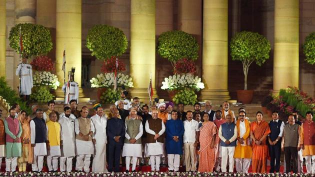 Prime Minister Narendra Modi and members of his cabinet stand for national anthem after taking oath during swearing-in ceremony, at Rashtrapati Bhavan, in New Delhi(Ajay Aggarwal/HT PHOTO)