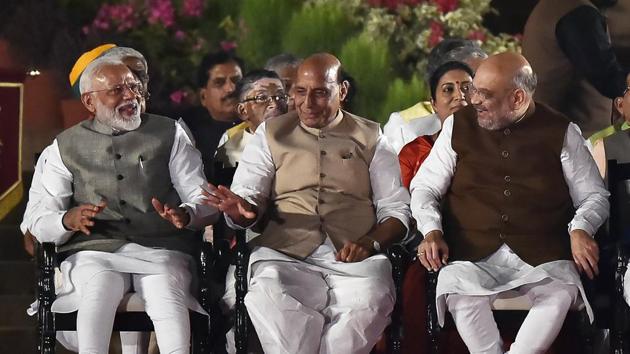 Prime Minister Narendra Modi with Rajnath Singh and Amit Shah at the swearing-in ceremony of his cabinet at Rashtrapati Bhavan, in New Delhi, on Thursday, May 30, 2019.(Ajay Aggarwal/HT PHOTO)