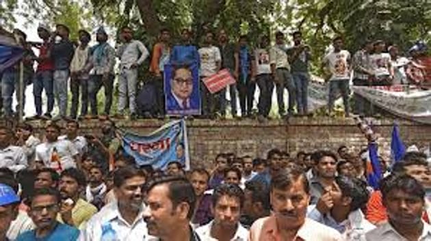 Members of various Dalit organisations in the national capital on Saturday organised a dharna, urging Rahul Gandhi to continue as the president of the Congress party.(HTPhotos)