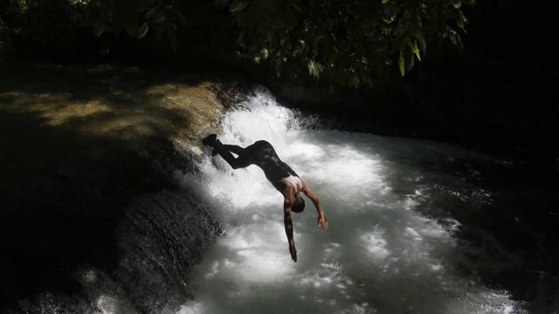 A boy dives into a stream on the outskirts of Srinagar, Jammu and Kashmir. (Mukhtar Khan / AP) A boy dives into a stream on the outskirts of Srinagar, Jammu and Kashmir. (Mukhtar Khan / AP)