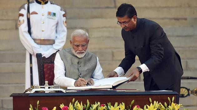 Prime Minister Narendra Modi signs affidavits of oath and secrecy after being sworn in to his second term in government, at the forecourt of Rashtrapati Bhavan in New Delhi. (Ajay Aggarwal / HT Photo) Prime Minister Narendra Modi signs affidavits of oath and secrecy after being sworn in to his second term in government, at the forecourt of Rashtrapati Bhavan in New Delhi. (Ajay Aggarwal / HT Photo)