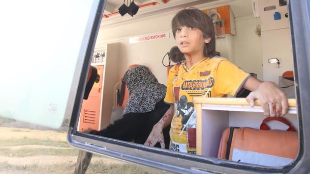 A wounded Syrian boy is pictured inside an ambulance following a reported air strike by regime forces and their allies on Maaret al-Noman in Syria’s southwestern Idlib province. (Abdulaziz Ketaz / AFP)