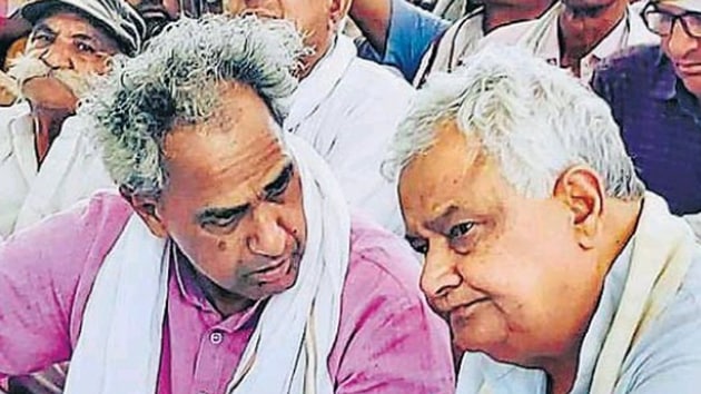 Congress MLA Harish Meena and BJP MP Kirori Lal Meena sitting on a dharna in Tonk district on Saturday.(HT Photo)