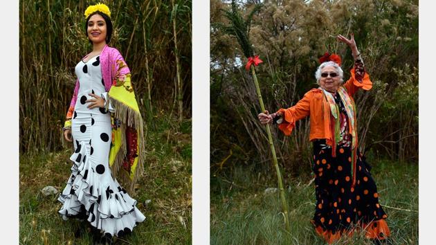 Melena Garro (L) and Joaquina Almellones (R), participants in the procession strike poses in their festive costumes. Wearing flowers in their hair and brightly coloured dresses, the women are joined by men in suits and hats. (Alvaro Barrientos / AP) Melena Garro (L) and Joaquina Almellones (R), participants in the procession strike poses in their festive costumes. Wearing flowers in their hair and brightly coloured dresses, the women are joined by men in suits and hats. (Alvaro Barrientos / AP)