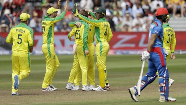 Australia's Alex Carey, fifth left, celebrates stumping the wicket of Afghanistan's Hashmatullah Shahidi. (AP)