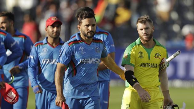 Australia's David Warner, right, and Afghanistan's captain Gulbadin Naib leave the field after the Cricket World Cup match between Afghanistan and Australia at Bristol County Ground in Bristol, England, Saturday, June 1, 2019. Australia won by seven wickets.(AP) Australia's David Warner, right, and Afghanistan's captain Gulbadin Naib leave the field after the Cricket World Cup match between Afghanistan and Australia at Bristol County Ground in Bristol, England, Saturday, June 1, 2019. Australia won by seven wickets.(AP)
