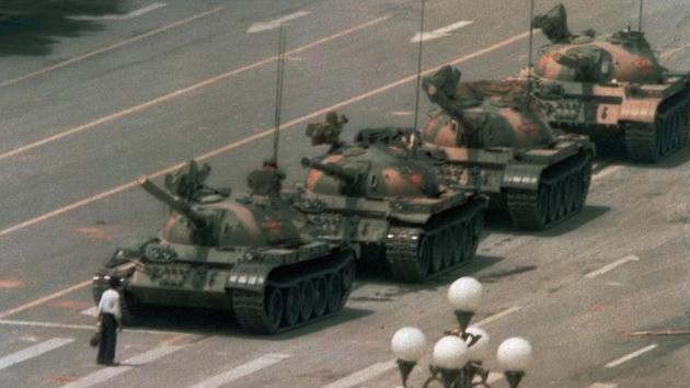 A Chinese man stands alone to block a line of tanks heading east on Beijing's Changan Blvd. in Tiananmen Square.(AP)