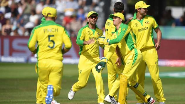Australia's Marcus Stoinis celebrates with teammates the wicket of Afghanistan's captain Gulbadin Naib. (AFP)