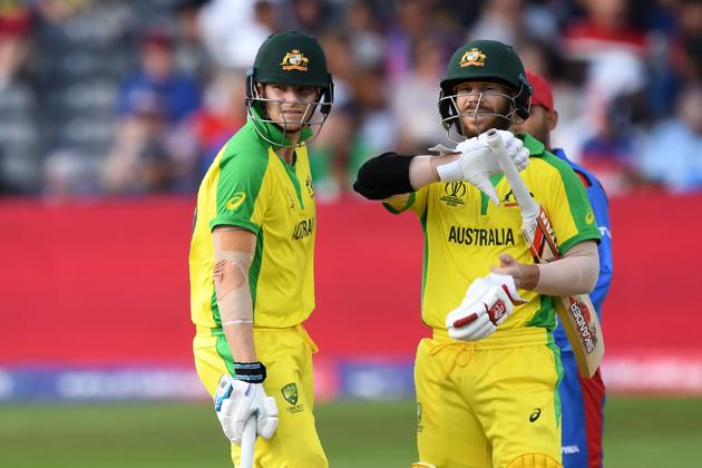 Australia's David Warner (R) and Australia's Steve Smith discuss during the 2019 Cricket World Cup group stage match. (AFP)