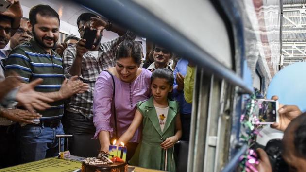 People celebrate the train’s birthday with a cake in Mumbai. Shah said, “When the train was introduced in 1930, it had dressing rooms, bathrooms, salon, dining car among others. It was also used to transport horses of the British army and citizens between Pune-Mumbai.” (Kunal Patil / HT Photo)