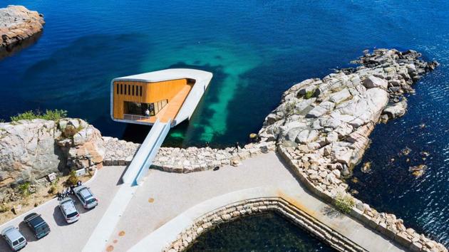 An aerial view of Under, a restaurant that is semi-submerged beneath the waters of the North Sea in Lindesnes near Kristiansand, Norway. “We have this small window next to the kitchen and every time some special kind of fish comes by, I always start thinking about how it would taste,” said chef Nicolai Ellitsgaard. (Jonathan Nackstrand / AFP)