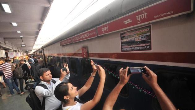 People take pictures of the train’s signage on its 90th birthday run in Pune. When it began chugging down the tracks, the Deccan Queen was the first deluxe train introduced on the railway to serve two important cities of the region and was aptly named after Pune, which is also known as “Queen of Deccan’’ (Dakkhan ki Rani). (HT Photo)
