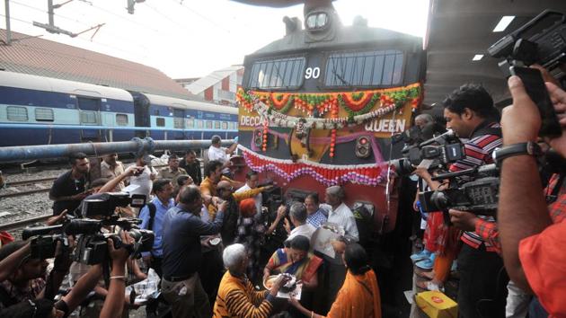 The Deccan Queen is ceremonially anointed before it departs for Mumbai from Pune on Saturday. Harsha Shah, President of the Railway Pravasi Group who has been travelling on Deccan Queen for 50 years, said, “A lot of people are emotionally attached to Deccan Queen. I have been celebrating the train’s birthday since I was 10.” (HT Photo)