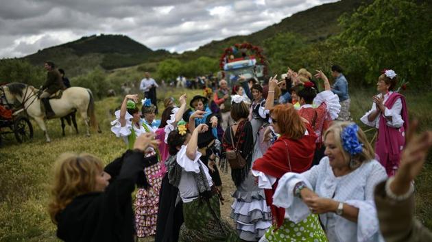Devotees of the Rocio Virgin dance while taking part in the “Romeria de El Rocio”. The pilgrimage is from Spain’s south, where it is still extremely popular. It was brought to the country’s north by migrants from southern Andalusía, who came here and to other parts of Spain in large numbers in the middle of the last century in search of work and better opportunities. (Alvaro Barrientos / AP) Devotees of the Rocio Virgin dance while taking part in the “Romeria de El Rocio”. The pilgrimage is from Spain’s south, where it is still extremely popular. It was brought to the country’s north by migrants from southern Andalusía, who came here and to other parts of Spain in large numbers in the middle of the last century in search of work and better opportunities. (Alvaro Barrientos / AP)