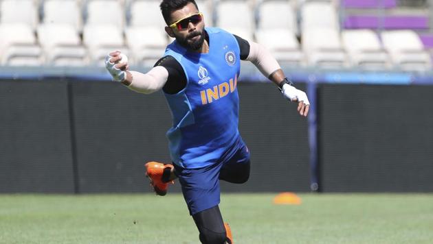 Southampton : India's captain Virat Kohli dives to catch the ball during a training session ahead of their Cricket World Cup match against South Africa at Ageas Bowl in Southampton, England, Saturday, June 1, 2019(AP)