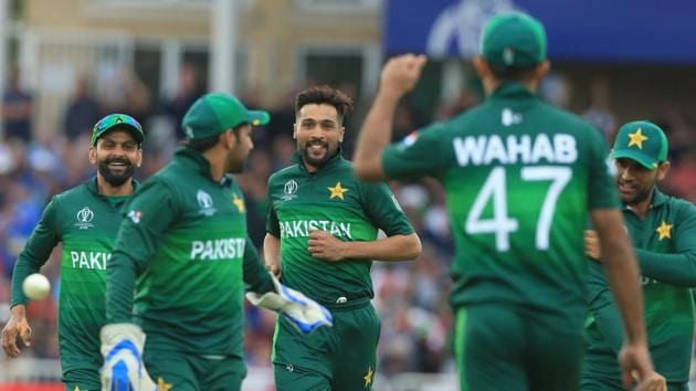 Pakistan's Mohammad Amir (C) celebrates after taking the wicket of England's Jos Buttler. (AFP)