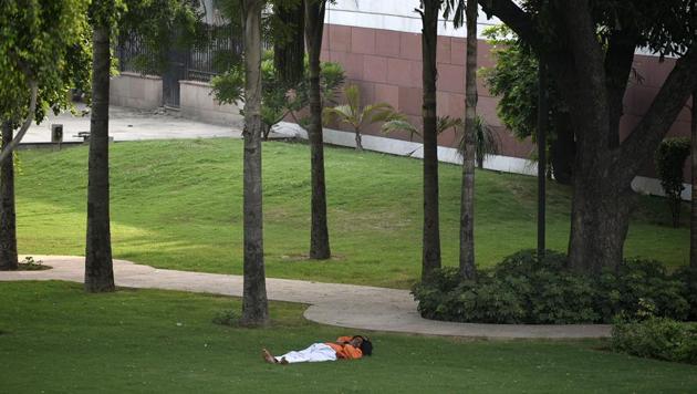 A man sleeps under the shade of tall trees on a hot summer day in New Delhi. A severe heatwave continued to sweep India’s northern plains as 10 places in the region figured on the list of 15 hottest places in the world on Sunday. Rajasthan’s Churu and Sri Ganganagar, where the mercury shot up to 48.9 and 48.6 degree Celsius, were the hottest places in the world. (Biplov Bhuyan / HT File) A man sleeps under the shade of tall trees on a hot summer day in New Delhi. A severe heatwave continued to sweep India’s northern plains as 10 places in the region figured on the list of 15 hottest places in the world on Sunday. Rajasthan’s Churu and Sri Ganganagar, where the mercury shot up to 48.9 and 48.6 degree Celsius, were the hottest places in the world. (Biplov Bhuyan / HT File)