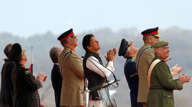 Pakistani Prime Minister Imran Khan applauses as he is observes the fly-past by Pakistan Air Force (PAF) JF-17 Thunder fighter jet during the Pakistan Day military parade in Islamabad, Pakistan March 23, 2019(REUTERS) Pakistani Prime Minister Imran Khan applauses as he is observes the fly-past by Pakistan Air Force (PAF) JF-17 Thunder fighter jet during the Pakistan Day military parade in Islamabad, Pakistan March 23, 2019(REUTERS)