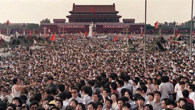 People gathered at Tiananmen Square on June 2, 1989. The April protests had begun to wane after 10 days but were re-energized by an editorial published in the official People’s Daily newspaper on April 26, titled “The Necessity for a Clear Stand Against Turmoil,” that described the protests as a “well-planned plot” to overturn Communist rule. Following its publication, protests broke out in cities around China. (Catherine Henriette / AFP File)
