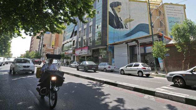 A mural painting of Ayatollah Khomeini covers the wall of a building in Tehran. On the one side are reformists “who insist on the popular elected legitimacy of institutions” and on the other are the conservatives focused on “divine legitimacy”, Therme said. While the disputes may rage over Khomeini’s political legacy there is little doubt that he transformed Iran and remains for many in the country a major authority. (Atta Kenare / AFP) A mural painting of Ayatollah Khomeini covers the wall of a building in Tehran. On the one side are reformists “who insist on the popular elected legitimacy of institutions” and on the other are the conservatives focused on “divine legitimacy”, Therme said. While the disputes may rage over Khomeini’s political legacy there is little doubt that he transformed Iran and remains for many in the country a major authority. (Atta Kenare / AFP)