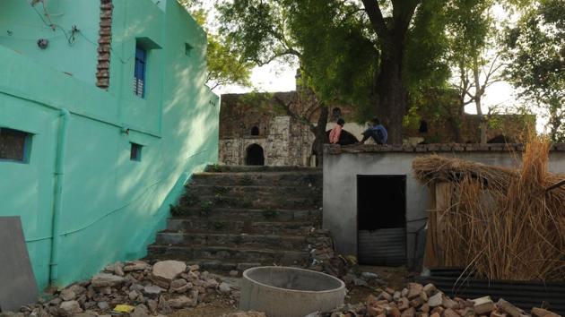 Qutab Khan Ki Masjid, however, is located only a few metres away from the Sohna Road in a small but congested area known as Saini Colony. The main entrance to the mosque lies inside the colony, through cobbled lanes, flanked by houses plastered with cow dung cakes. The mosque’s view is partially blocked by a house to its left and a newly constructed storehouse to its right. (Parveen Kumar / HT Photo) 