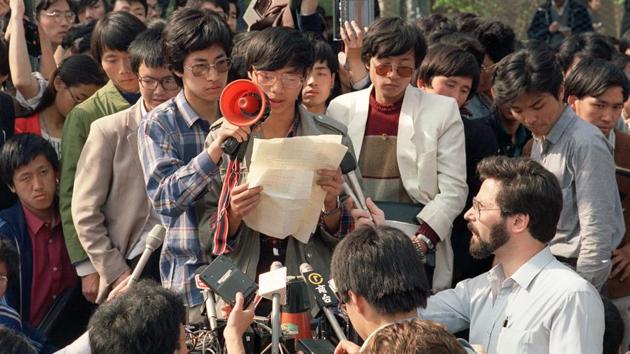 Wang Dan (C), a dissident during the demonstrations and member of the Beida students delegation, addresses foreign correspondents in Beijing on May 01, 1989. The death of Hu Yaobang, a leading liberal voice in the Party, deposed by Deng Xiaoping in 1987 for campus demonstrations calling for political reforms, attracted mourners to Tiananmen Square in April. They called for continuing his reformist legacy. (Catherine Henriette / AFP)