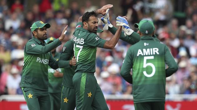 Pakistan's Wahab Riaz, center, celebrates with teammates the dismissal of England's Jonny Bairstow. (AP)