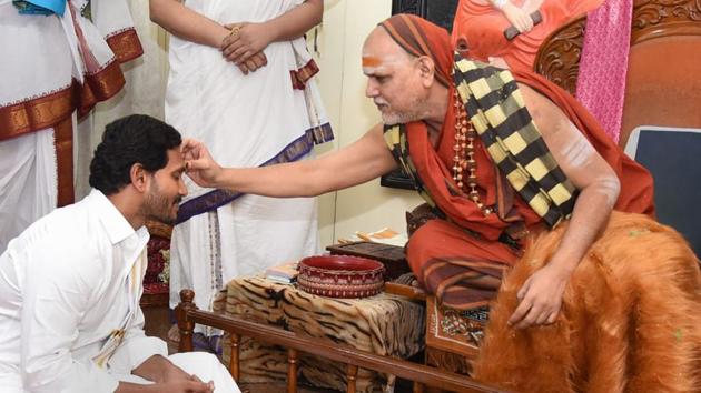 Andhra Pradesh Chief Minister Y S Jagan Mohan Reddy seeks blessings of Swami Swaroopanandendra Saraswati at Sarada Peetham in Vishakapatnam on Tuesday. (PTI) Andhra Pradesh Chief Minister Y S Jagan Mohan Reddy seeks blessings of Swami Swaroopanandendra Saraswati at Sarada Peetham in Vishakapatnam on Tuesday. (PTI)