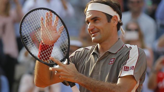 Switzerland's Roger Federer celebrates winning his quarterfinal match of the French Open tennis tournament.(AP)