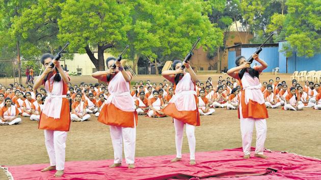 During the eight-day training session, Durga Vahini Prashikshan, VHP women’s wing members participate in air rifle and sword drills, as seen in this session held on Monday. Sunday, however, members were seen brandishing rifles and swords during a public march in Nigdi. (HT/PHOTO) During the eight-day training session, Durga Vahini Prashikshan, VHP women’s wing members participate in air rifle and sword drills, as seen in this session held on Monday. Sunday, however, members were seen brandishing rifles and swords during a public march in Nigdi. (HT/PHOTO)