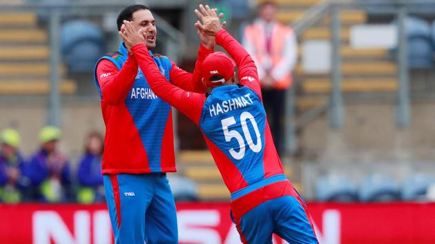 Afghanistan's Mohammad Nabi celebrates with Hashmatullah Shahidi after taking the wicket of Sri Lanka's Lahiru Thirimanne. (Action Images via Reuters)