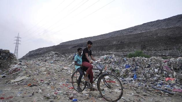 The Ghazipur landfill in New Delhi is on course to rise higher than the Taj Mahal in the next year, becoming a symbol for what the UN considers the world’s most polluted capital. Ghazipur was opened in 1984 and reached its capacity in 2002 but the city’s detritus has kept on arriving. According to East Delhi’s superintendent engineer Arun Kumar, it is already more than 65 metres high. (Sunil Ghosh / HT Archive) The Ghazipur landfill in New Delhi is on course to rise higher than the Taj Mahal in the next year, becoming a symbol for what the UN considers the world’s most polluted capital. Ghazipur was opened in 1984 and reached its capacity in 2002 but the city’s detritus has kept on arriving. According to East Delhi’s superintendent engineer Arun Kumar, it is already more than 65 metres high. (Sunil Ghosh / HT Archive)