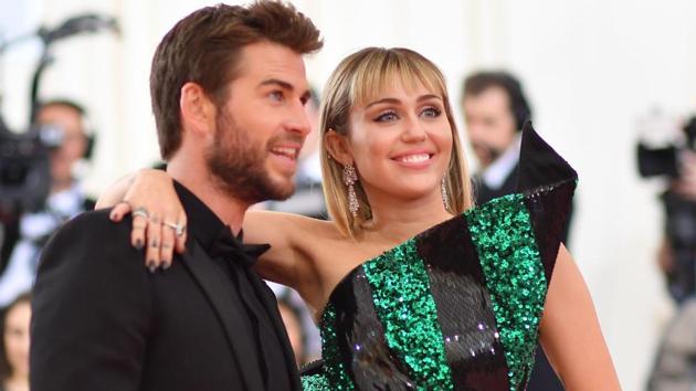 Miley Cyrus and Liam Hemsworth arrive for the 2019 Met Gala at the Metropolitan Museum of Art.(AFP)