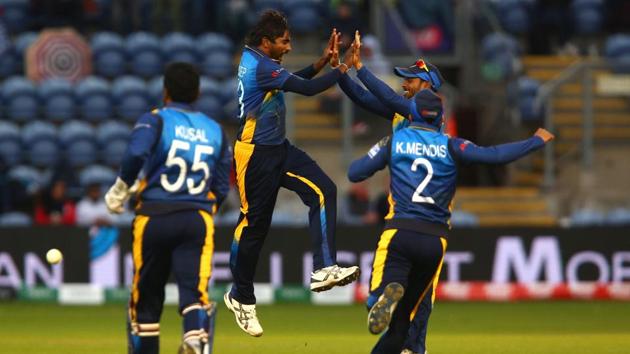 Sri Lanka's Nuwan Pradeep (2L) celebrates with team mates after taking the wicket of Afghanistan's Rashid Khan(AFP)