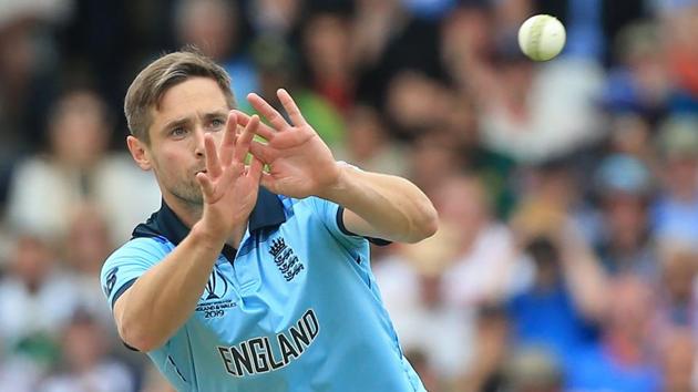 England's Chris Woakes receives the ball during the 2019 Cricket World Cup group stage match between England and Pakistan(AFP)