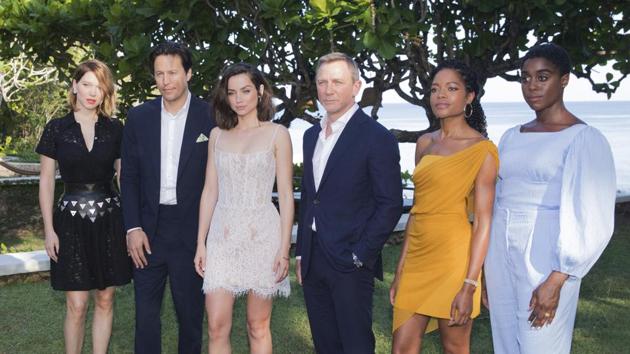 Actress Lea Seydoux, from left, director Cary Joji Fukunaga, actors Ana de Armas, Daniel Craig, Naomie Harris and Lashana Lynch pose for photographers during the photo call of the latest installment of the James Bond film franchise, currently known as 'Bond 25' in Oracabessa, Jamaica, Thursday, April 25, 2019.(AP)
