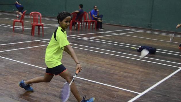 Ananya Gadgil playing at the Pune district badminton championship at Modern Sports complex, Shivajinagar, on Tuesday. (RAVINDRA JOSHI/HT) Ananya Gadgil playing at the Pune district badminton championship at Modern Sports complex, Shivajinagar, on Tuesday. (RAVINDRA JOSHI/HT)