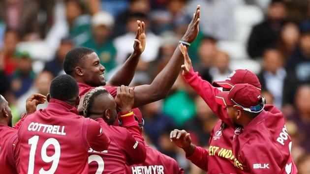 ICC Cricket World Cup - West Indies v Pakistan - Trent Bridge, Nottingham, Britain - May 31, 2019 West Indies' Jason Holder celebrates with team mates after taking the wicket of Pakistan's Sarfaraz Ahmed Action Images via Reuters/Jason Cairnduff/File Photo(Action Images via Reuters)