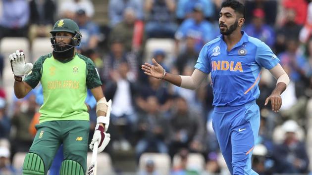 India's Jasprit Bumrah, right, reacts after bowling a delivery. (AP)
