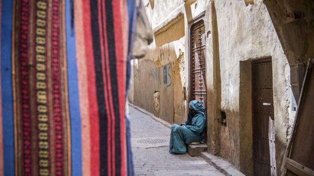 A woman seen sitting in the 9th century walled medina. Following the royal visit, authorities issued a report insisting that the rehabilitation work respect the medina’s “authenticity” and “original architecture”. The ancient medina is a live treasure, hidden and secret, which cannot be taken lightly. (Fadel Senna / AFP)