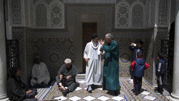 Men gather at the Moulay Idriss II mausoleum in medina. Home to the world’s oldest working library, the medina was listed as a UNESCO World Heritage Site in 1981 for its “outstanding universal value”. Like many monuments it has been renovated after the authorities in the late 1980s sounded the alarm in a report saying that more than half of its buildings were crumbling. (Fadel Senna / AFP)