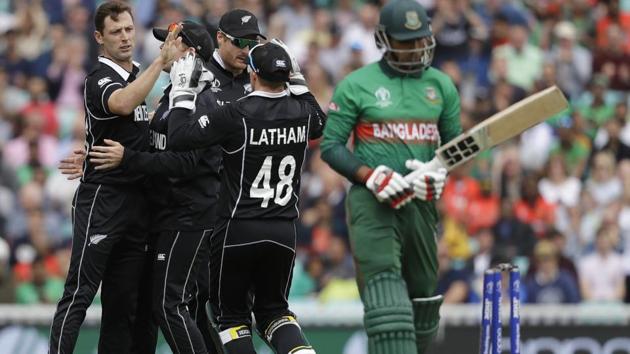 New Zealand's Matt Henry, left, celebrates taking the wicket of Bangladesh's Soumya Sarkar. (AP)