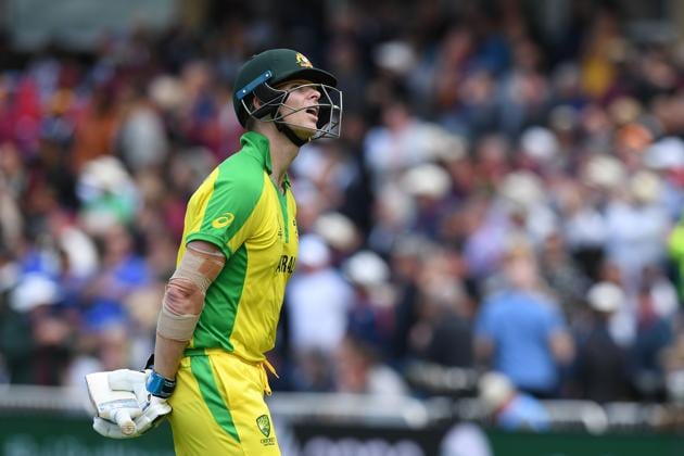 Australia's Steve Smith watches the catch on the big screen after losing his wicket for 73 during the 2019 Cricket World Cup group stage match between Australia and West Indies at Trent Bridge in Nottingham. (AFP)
