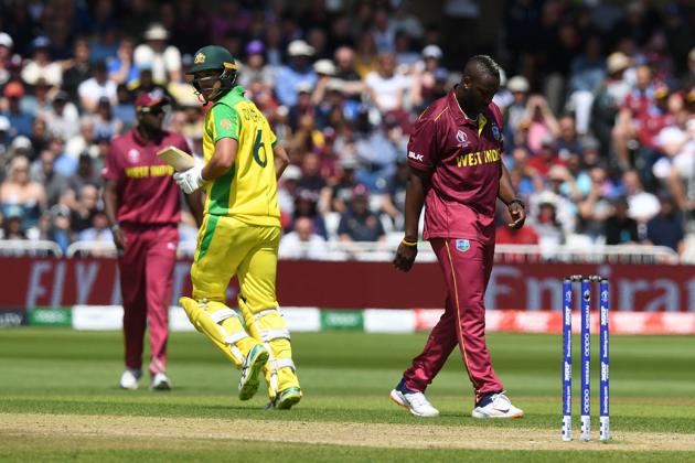 West Indies' Andre Russell (R) leaves the crease with an injury during the 2019 Cricket World Cup group stage match between Australia and West Indies at Trent Bridge in Nottingham. (AFP)
